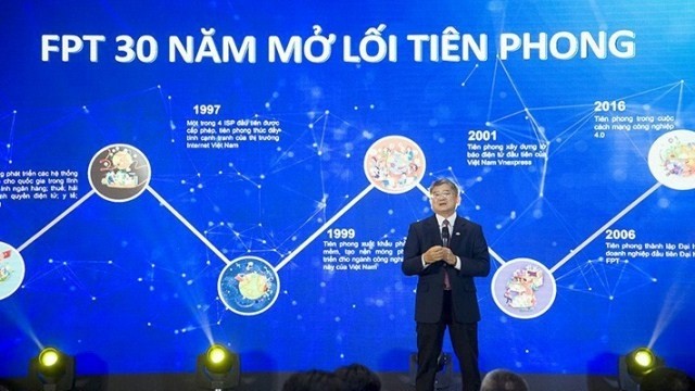 FPT CEO Bui Quang Ngoc discusses the establishment of his company 30 years ago. (Photo: NDO/Khanh Bang)