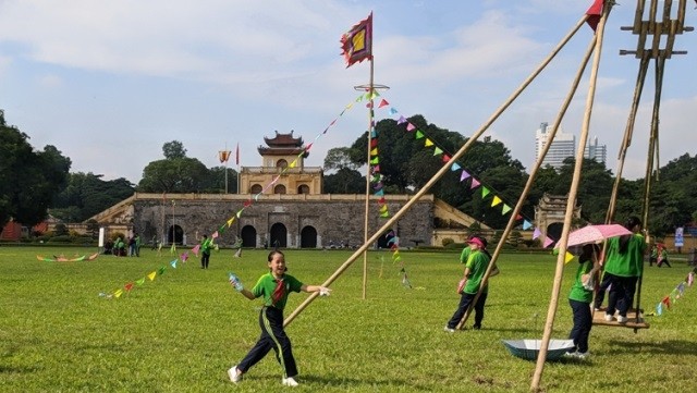School children play folk games at a programme held at the Thang Long imperial citadel 