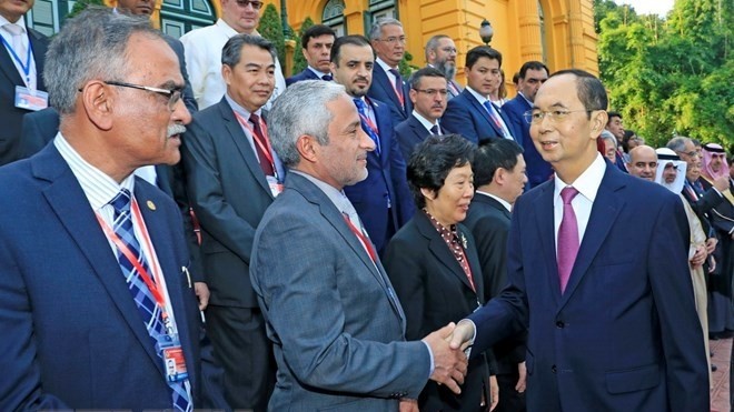 President Tran Dai Quang and the delegates. (Photo: VNA)
