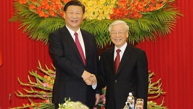 Vietnamese Party General Secretary Nguyen Phu Trong (R) and Chinese Party General Secretary and President Xi Jinping during the latter's visit to Vietnam in November 2017. 