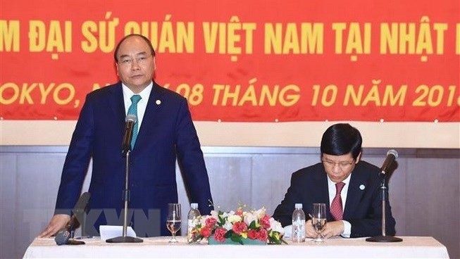 Prime Minister Nguyen Xuan Phuc addresses the meeting with the Vietnamese community in Japan on October 8 (Photo: VNA)