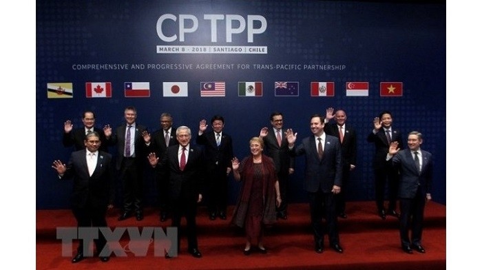 The CPTPP signing ceremony with the participation of Chilean President Michelle Bachelet (front, middle) in Santiago de Chile on March 8. (Photo: VNA)