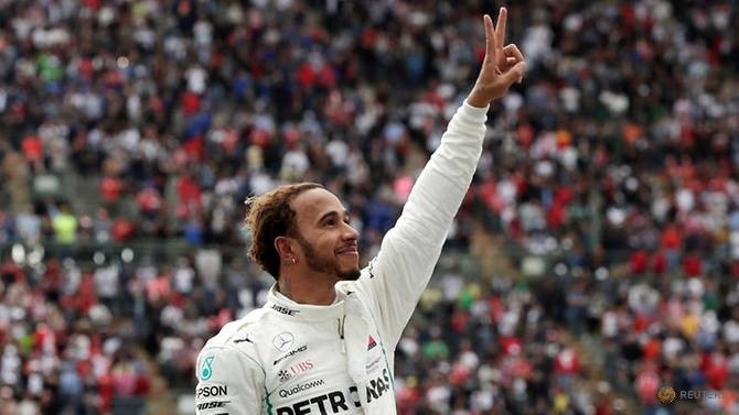 Mercedes' Lewis Hamilton celebrates after winning the World Championship. (Reuters)