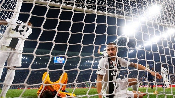 Juventus' Leonardo Bonucci looks dejected after scoring an own goal and the second for Manchester United. (Reuters)