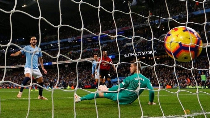 Manchester City's Ilkay Gundogan scores their third goal. (Reuters)