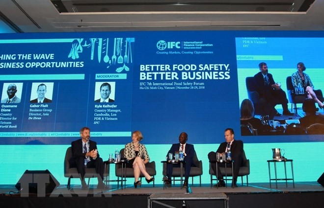 Researchers and experts discuss at the IFC 7th International Food Safety Forum in HCM City on November 28. (Photo: VNA)