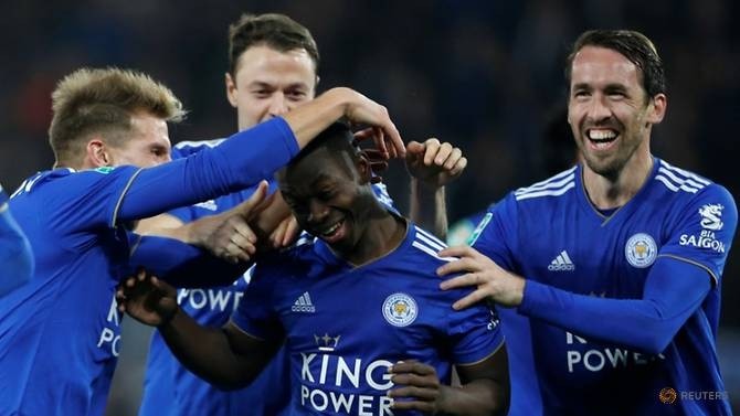 Leicester City's Nampalys Mendy celebrates with teammates after scoring the winning penalty during the shootout. (Reuters)