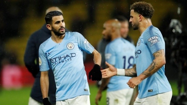 Manchester City's Riyad Mahrez and Kyle Walker celebrate after the match at Vicarage Road, Watford, Britain, on December 4, 2018. (Photo: Action Images via Reuters)