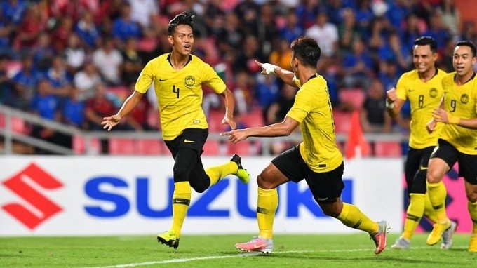 Malaysian players celebrate scoring a goal during the match at Thailand. 