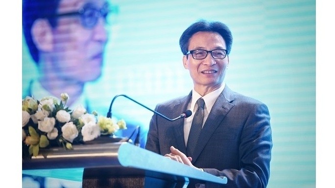 Deputy Prime Minister Vu Duc Dam chairs a tourism forum in Hanoi on December 6 to discuss major measures to develop high-quality and sustainable tourism in Vietnam by 2030. (Photo: enternews.vn)