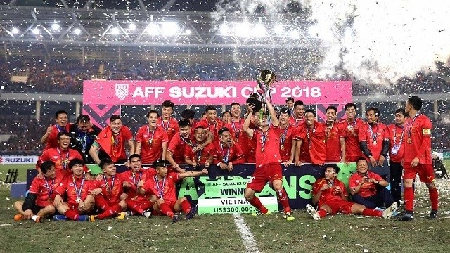 Vietnamese players celebrate winning their second AFF Cup trophy in history.