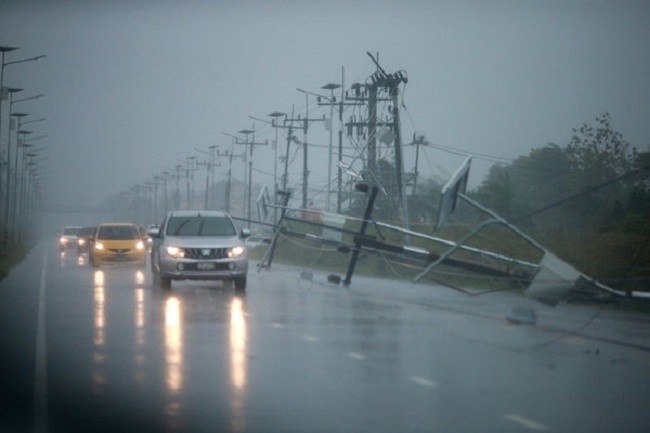 Fallen electricity poles along a road in southern Thailand. (Photo: Reuters)