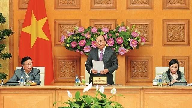 Prime Minister Nguyen Xuan Phuc speaking at a meeting with VACHE Chairman Nguyen Hong Quan (Photo: Tran Hai)