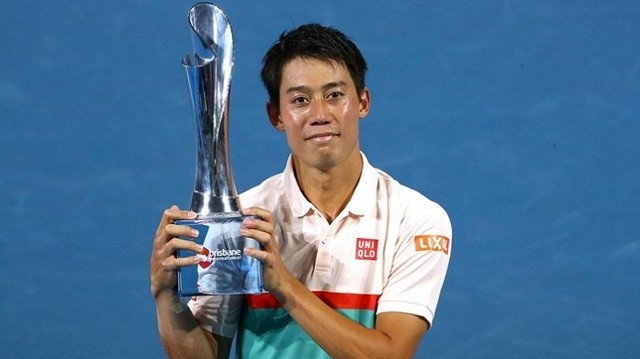 Japan's Kei Nishikori celebrates with the trophy after winning the final against Russia's Daniil Medvedev. (Photo: Reuters)