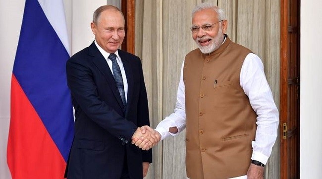 Indian Prime Minister Narendra Modi welcomes Russian President Vladimir Putin prior to their meeting at Hyderabad House in New Delhi, India October 5, 2018. (Source: Reuters)