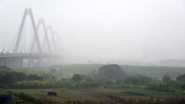 Seen from Dong Anh district, Hanoi city seems to be hidden in a layer of foggy drizzle.