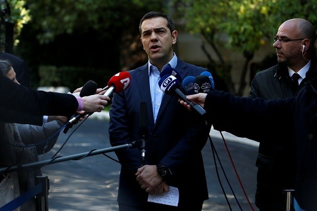 Greek PM Tsipras makes statements to the press following his meeting with resigned coalition partner Panos Kammenos in Athens. (Photo: Reuters)