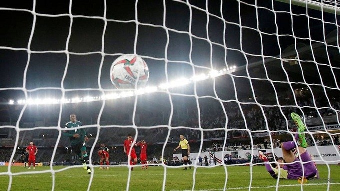 Ahmed Khalil of United Arab Emirates scores their third goal from the penalty spot. (Reuters)