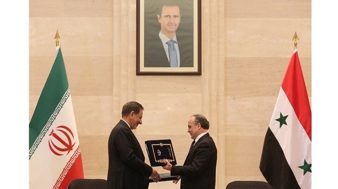 The documents were signed during a meeting between Iranian First Vice-President Eshaq Jahangiri (left) and Syrian Prime Minister Imad Khamis in Damascus.