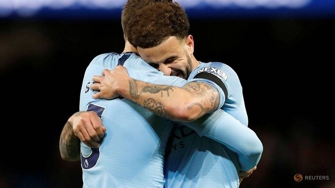 Manchester City's Kyle Walker and John Stones celebrate after the match. (Reuters)
