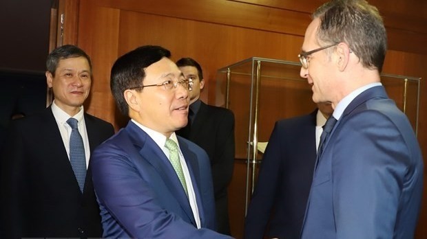 Deputy Prime Minister and Foreign Minister Pham Binh Minh and German Foreign Minister Heiko Maas (R) (Source: VNA) 