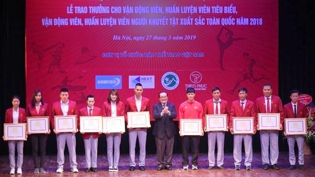 Outstanding athletes, coaches honoured at the event (Photo: VNA)
