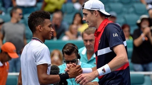 John Isner (right) greets Felix Auger-Aliassime (left) after Isner defeated Auger-Aliassime in the men's semi-final at the Miami Open at Miami Open Tennis Complex, Miami Gardens, FL, USA, Mar 29, 2019. (Photo: USA TODAY Sports)