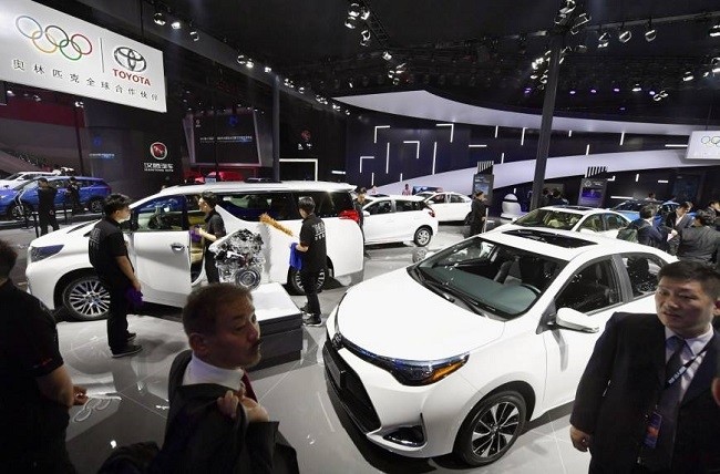 (Illustrative Image).Visitors view cars at Toyota Motor Corp.'s booth, as the Guangzhou International Automobile Exhibition opens at the China Import and Export Fair Complex in Guangzhou. (File photo: Kyodo)