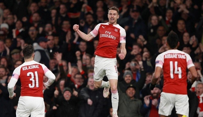 Arsenal's Aaron Ramsey celebrates scoring their first goal with Sead Kolasinac and Pierre-Emerick Aubameyang. (Reuters)