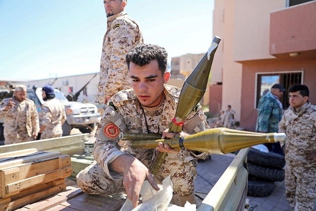 Members of Misurata forces prepare themselves to go to the front line in Tripoli, Libya, April 8. Militia forces, including Misurata’s, are aiding government troops against an insurgency that threaten to overthrow Prime Minister Fayez al-Sarraj’s UN-backed regime. (Photo: Reuters)