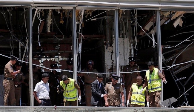Crime scene officials inspect the explosion area at Shangri-La hotel in Colombo, Sri Lanka April 21, 2019. (Photo: Reuters)