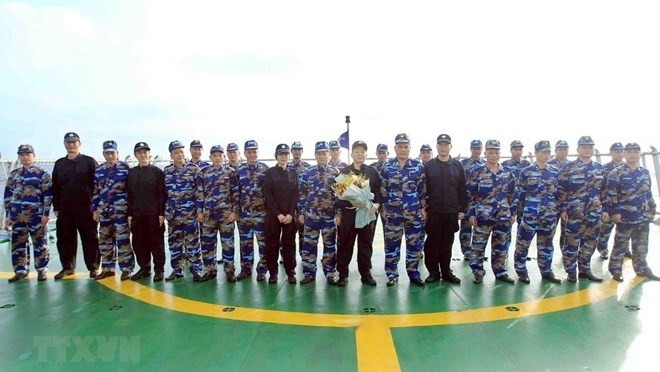 Vietnamese, Chinese coast guards at the event (Photo: VNA)