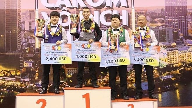 Vietnam's no. 1 cueist Tran Quyet Chien takes the Asian three-cushion carom trophy.