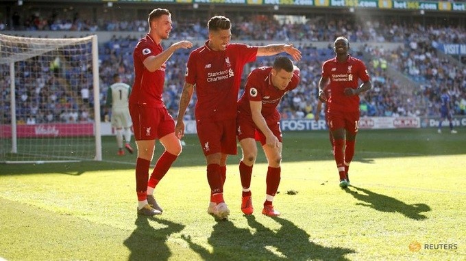 Premier League - Cardiff City v Liverpool - Cardiff City Stadium, Cardiff, Britain - April 21, 2019 Liverpool's James Milner celebrates scoring their second goal with team mates. (Reuters)