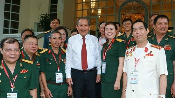 Permanent Deputy Prime Minister Truong Hoa Binh has urged war veterans to gather and promote their strengths in order to contribute more effectively to the cause of national renewal. (Photo:VNA)