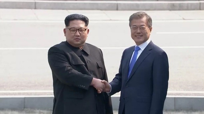 DPRK Chairman Kim Jong Un (left) and RoK President Moon Jae-in shake hands during their meeting on April 27, 2018. (Photo: Reuters)