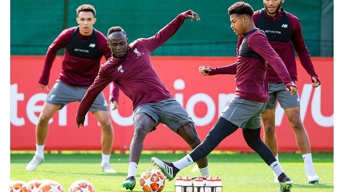 Liverpool’s Sadio Mane (left) challenges Rhian Brewster, who could make a first-team debut against Barcelona, during a team training session at Melwood. (Photo: EPA)