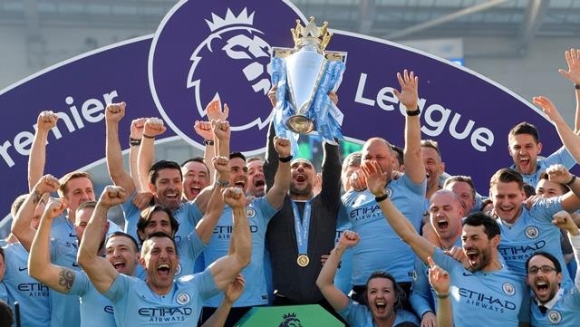 Manchester City manager Pep Guardiola lifts the trophy as they celebrate winning the Premier League - Premier League - Brighton & Hove Albion v Manchester City - The American Express Community Stadium, Brighton, Britain - May 12, 2019. (Photo: Reuters)