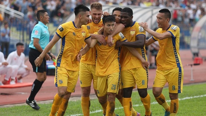 Thanh Hoa players celebrate Trong Hung's opening goal.