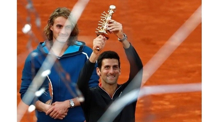 Serbia's Novak Djokovic and Greece's Stefanos Tsitsipas pose with their trophies after Novak Djokovic wins the final - ATP 1000 - Madrid Open - The Caja Magica, Madrid, Spain - May 12, 2019. (Photo: Reuters)