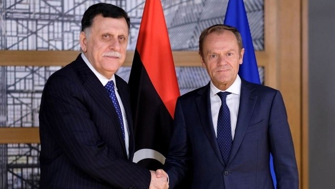 Prime Minister of Libya’s internationally recognised GNA, Fayez al-Sarraj, poses with European Council President Donald Tusk in Brussels, Belgium, May 13, 2019. (Reuters)