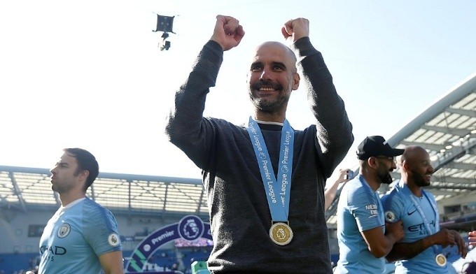 Soccer Football - Premier League - Brighton & Hove Albion v Manchester City - The American Express Community Stadium, Brighton, Britain - May 12, 2019 Manchester City manager Pep Guardiola celebrates winning the Premier League. (Reuters)