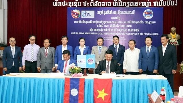 At the signing of an MOU between Viet-Lao BACI and YEAL in Vientiane on May 14.