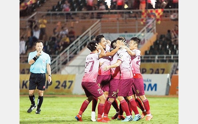 Saigon FC players celebrate a goal during their match with Viettel.