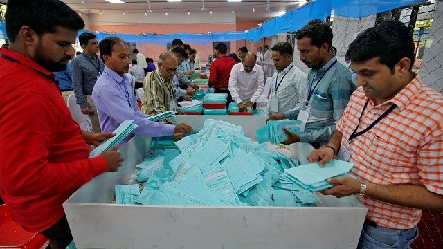 Indian election staff members sort ballot papers before counting them inside a vote counting centre in Ahmedabad, India, May 23, 2019. (Photo: Reuters)