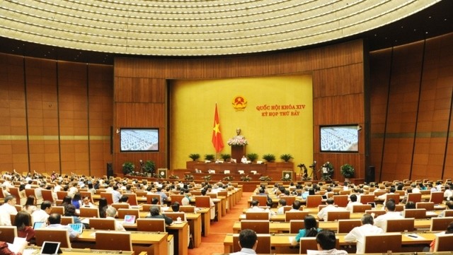 NA deputies discuss during the 11th working day of the 14th NA’s 7th session in Hanoi on June 3. (Photo: NDO/Tran Hai)