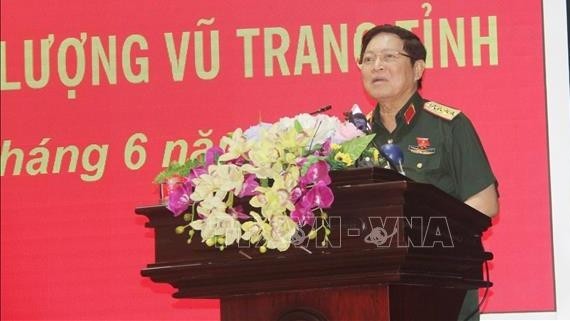 General Ngo Xuan Lich speaks at the meeting with voters from Ha Nam province. (Photo: VNA)