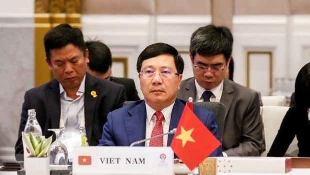 eputy Prime Minister and Foreign Minister Pham Binh Minh at the meeting (Photo: VNA)