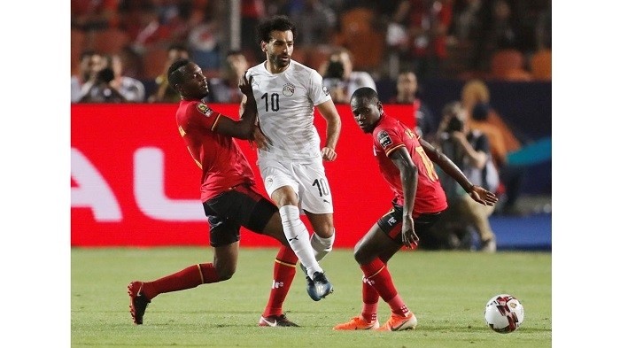 Egypt's Mohamed Salah in action with Uganda's Faruku Miya - Africa Cup of Nations 2019 - Group A - Uganda v Egypt - Cairo International Stadium, Cairo, Egypt - June 30, 2019. (Photo: Reuters)