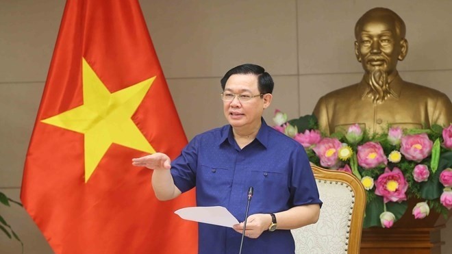 Deputy Prime Minister Vuong Dinh Hue speaks at the meeting of Steering Committee for Price Management in Hanoi on July 3 (Photo: VNA)